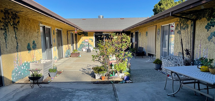 Outside patio with seating and plants.